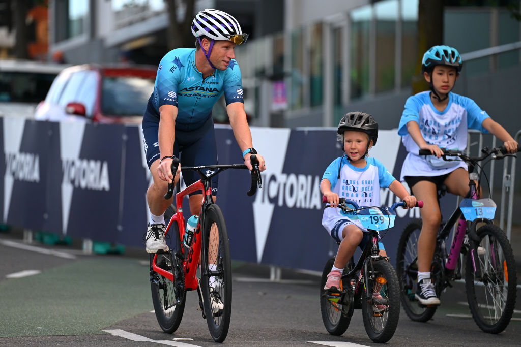 Family cycling event with children and a pro cyclist