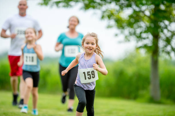 Family running together in an outdoor race
